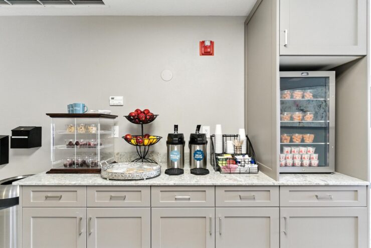 A welcoming refreshment area with fruits, beverages, and treats, perfect for fostering community connections.