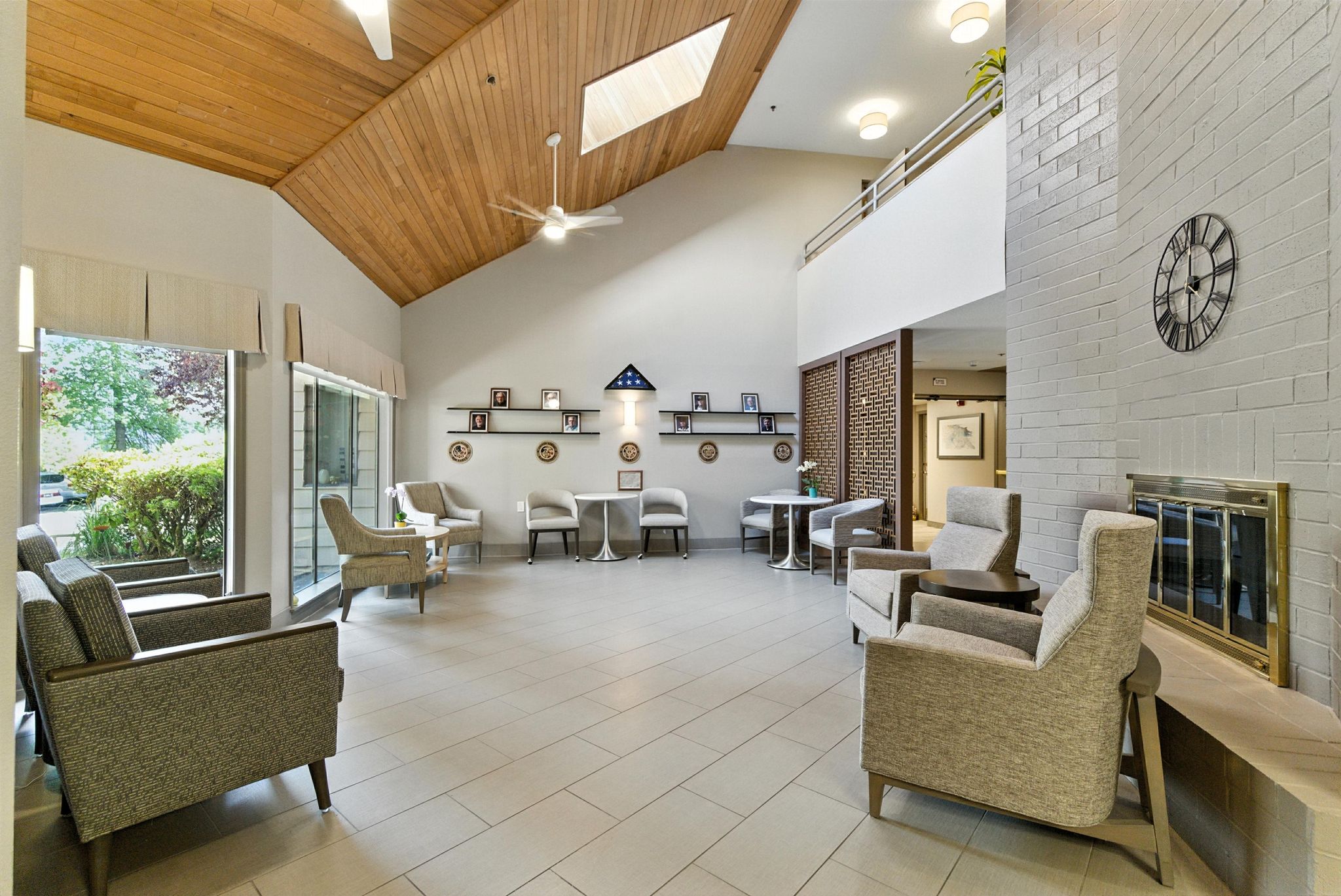 A bright, inviting common area featuring comfortable seating, natural light, and personal touches, fostering community.