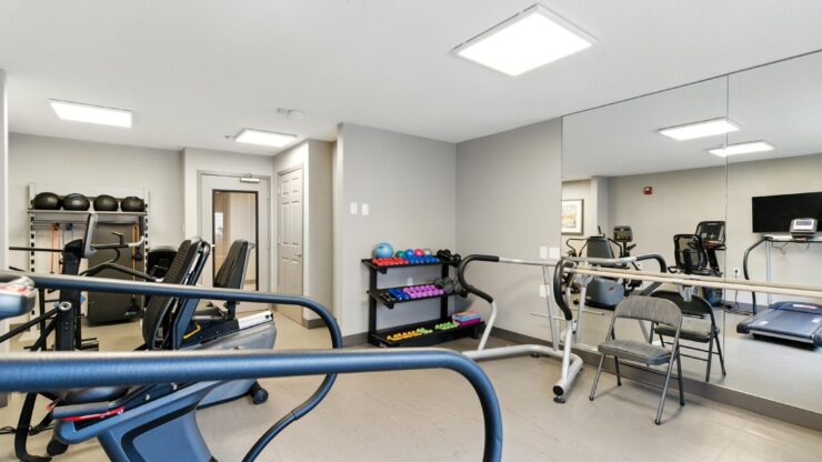 A bright, welcoming fitness area equipped for active living and fostering community connections.