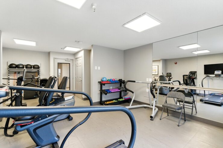 A bright, welcoming fitness area equipped for active living and fostering community connections.