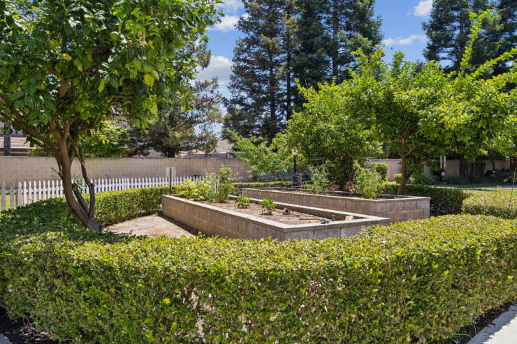 A serene garden space with lush greenery, inviting residents to enjoy nature and community activities.