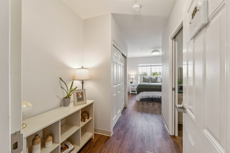 A warm, inviting hallway leads to comfortable living spaces, fostering a sense of community and belonging.