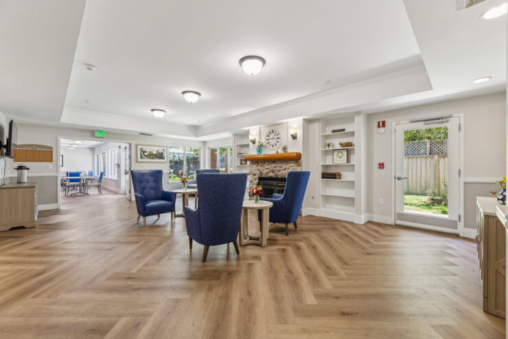 Inviting common area with comfortable seating, bright natural light, and a warm, welcoming atmosphere.