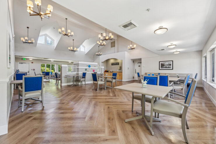 Bright, welcoming dining space with elegant decor, fostering community and comfort for residents.