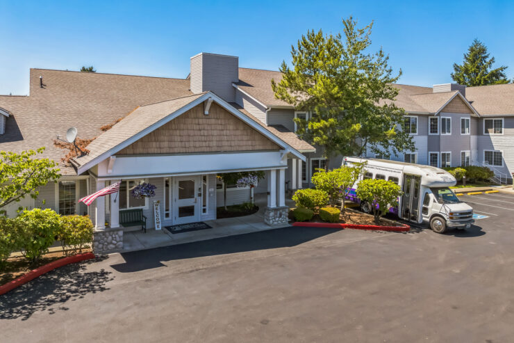 A welcoming entrance surrounded by vibrant greenery, inviting residents to enjoy community life.