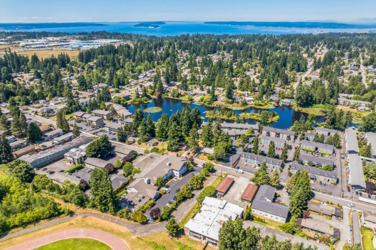 A serene community surrounded by lush greenery and calming waters, perfect for relaxation and connection.