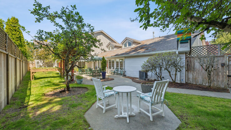 A serene outdoor space with inviting seating, perfect for community gatherings and relaxation.