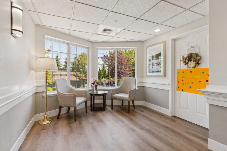 A welcoming corner with natural light, inviting seating, and a sense of community and comfort.