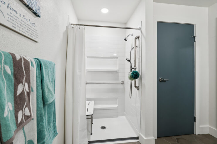 Bright and inviting, this accessible bathroom emphasizes comfort and safety for residents.