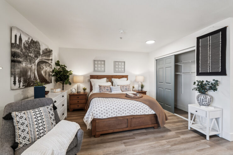 A welcoming bedroom filled with warmth, featuring comfortable furnishings and a serene atmosphere.