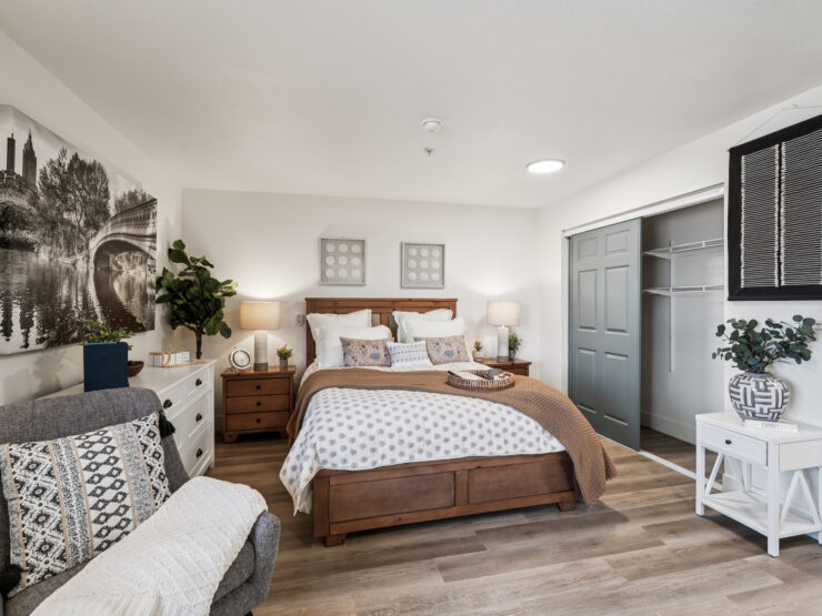 A welcoming bedroom filled with warmth, featuring comfortable furnishings and a serene atmosphere.