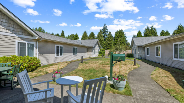 A serene outdoor space invites residents to relax and connect in a welcoming community setting.
