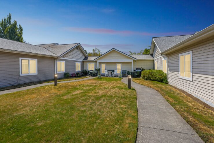 A welcoming community surrounded by serene gardens, inviting residents to relax and connect.