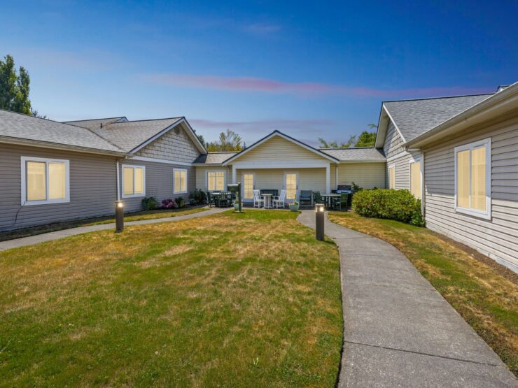 A welcoming community surrounded by serene gardens, inviting residents to relax and connect.