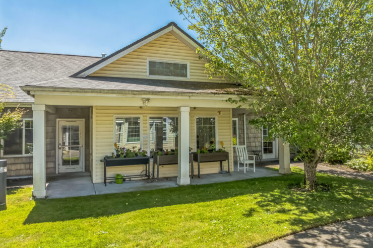 A welcoming home with vibrant gardens, inviting spaces, and a serene atmosphere for community living.