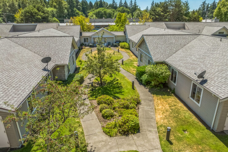 Welcoming pathways and vibrant greenery create a serene community atmosphere for residents to enjoy.