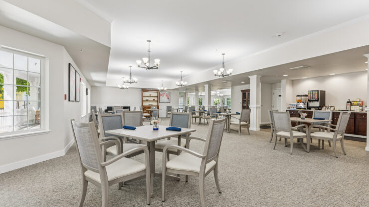 A welcoming dining area filled with light, inviting residents to connect and enjoy shared meals.