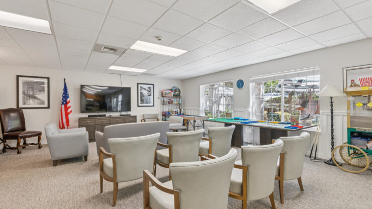 A welcoming lounge area with comfortable seating fosters community and connection among residents.