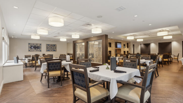 Bright dining area with elegant decor, inviting tables, and a warm atmosphere for community gatherings.