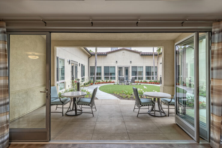 A welcoming courtyard with seating invites community gatherings and relaxation in a serene environment.