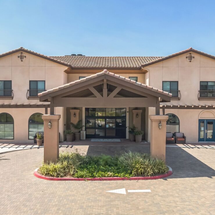 A welcoming entrance with lush landscaping, inviting residents to enjoy a vibrant community.