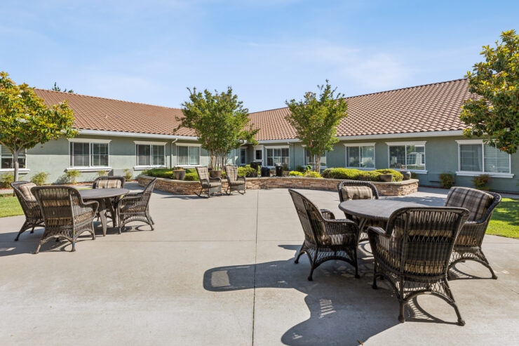 A serene outdoor space with inviting seating, perfect for community gatherings and relaxation.