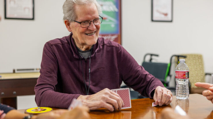 Lively card game among friends, fostering connection and joy in a welcoming community space.