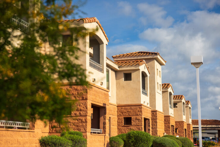 Welcoming architecture nestled among lush greenery, creating a serene community atmosphere.