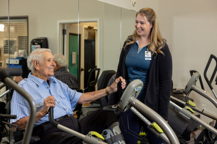 A warm interaction between a resident and staff member fosters a sense of community and support.