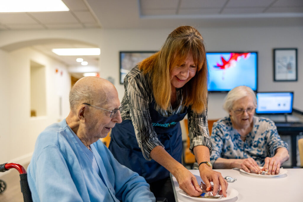 Engaging residents enjoy a shared activity, highlighting community spirit and warmth in a welcoming space.