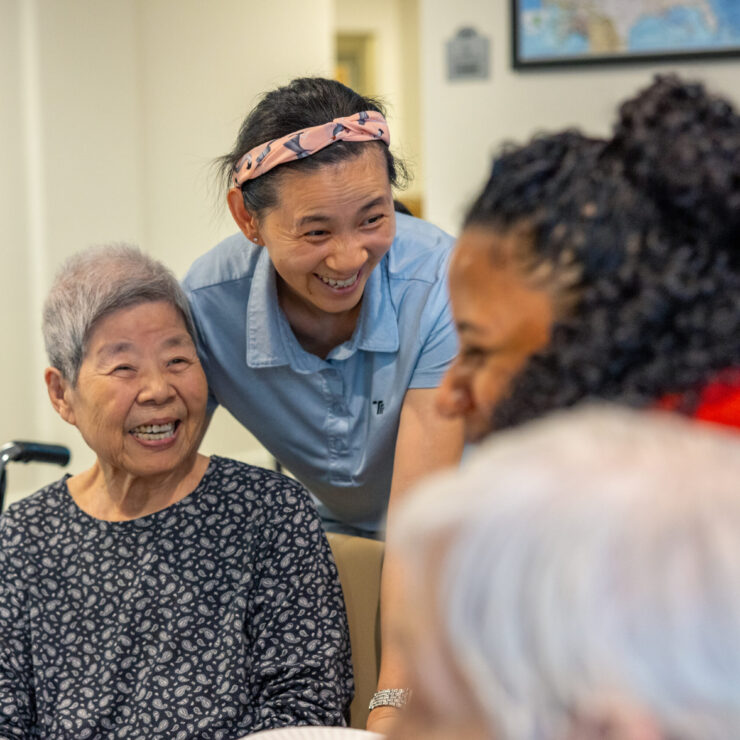 Lively interactions among residents and staff create a warm, welcoming community atmosphere.