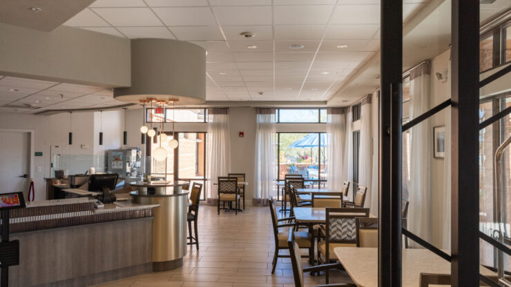 A bright, welcoming space with comfortable seating and natural light, perfect for community gatherings.