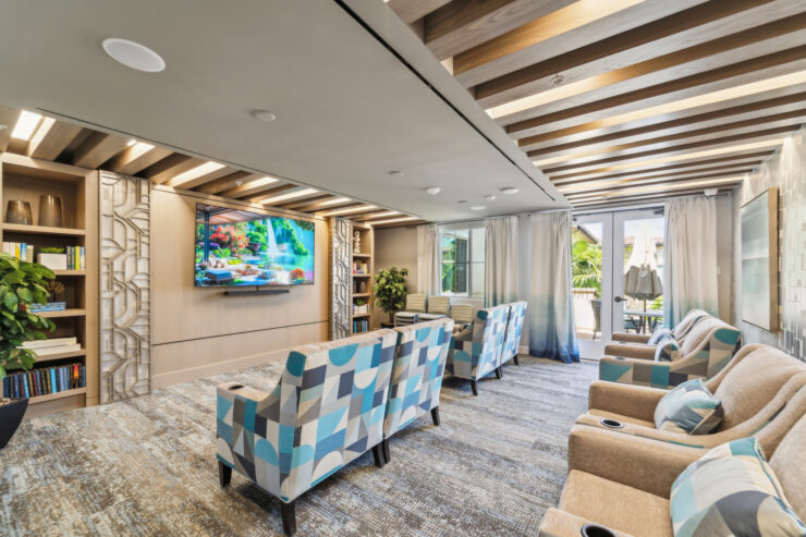 A bright, inviting lounge features comfortable seating and vibrant decor, fostering connection and relaxation.
