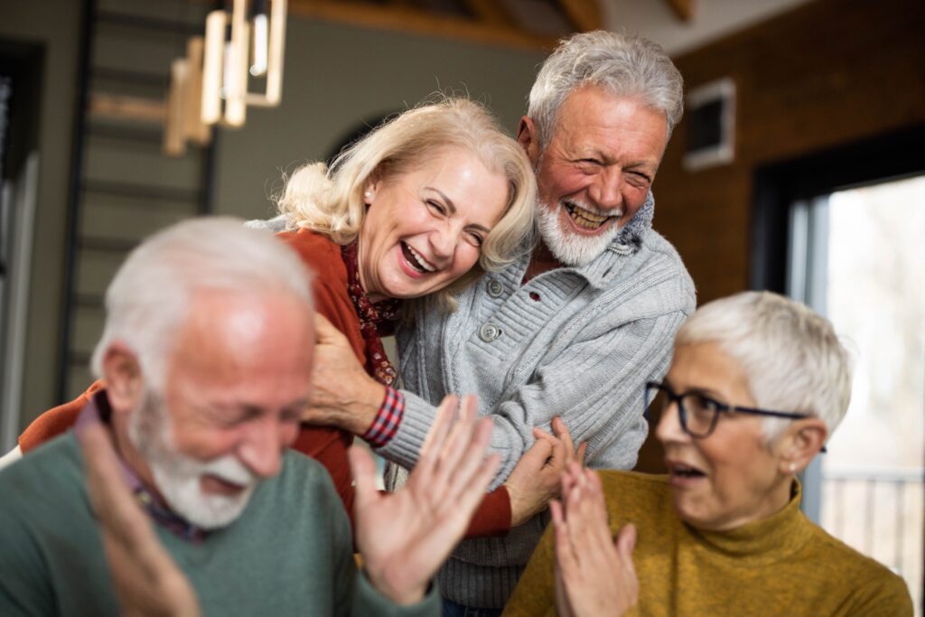 Laughter and joy fill the room as friends share a heartfelt moment, celebrating community and connection.