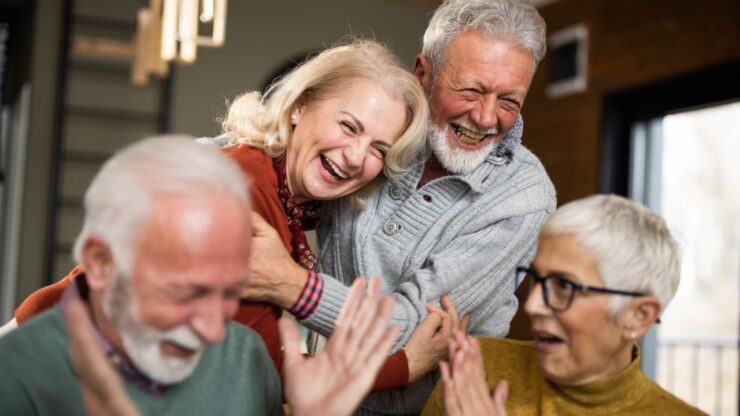 Laughter and joy fill the room as friends share a heartfelt moment, celebrating community and connection.