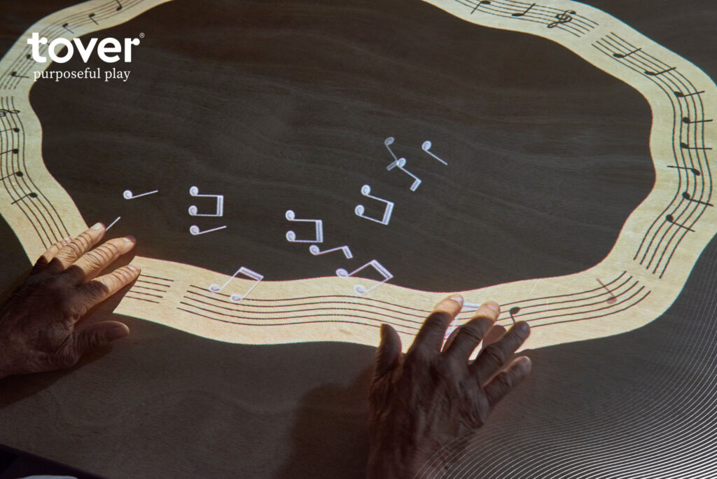 Engaging hands explore musical notes, creating a joyful atmosphere of connection and creativity.