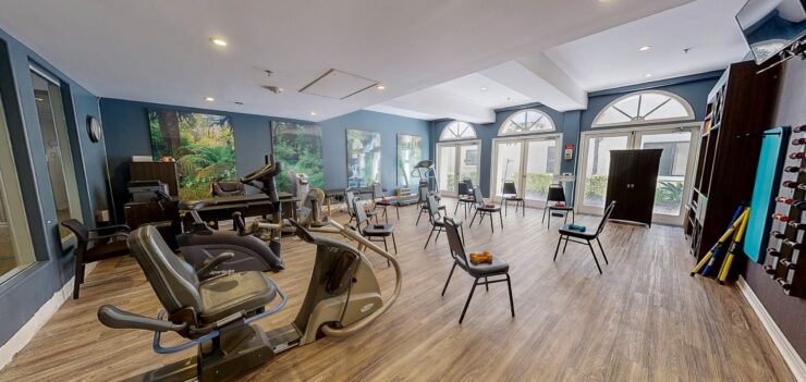 A bright, welcoming fitness area with equipment and seating, perfect for community engagement and wellness.