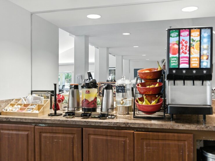 A welcoming refreshment station, inviting residents to enjoy drinks and snacks in a vibrant community space.