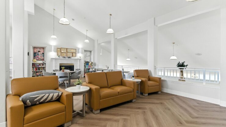 A welcoming lounge with warm seating and natural light, perfect for community gatherings and relaxation.