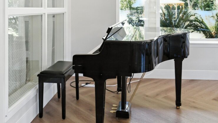 A grand piano invites joyful music-making, enhancing the warm, welcoming atmosphere of community life.