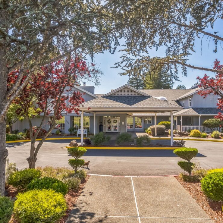 A welcoming entrance surrounded by vibrant greenery, inviting residents to enjoy community life.