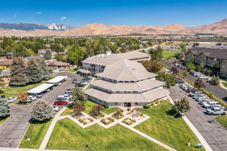 A welcoming retirement community nestled in a scenic landscape, fostering connection and comfort.