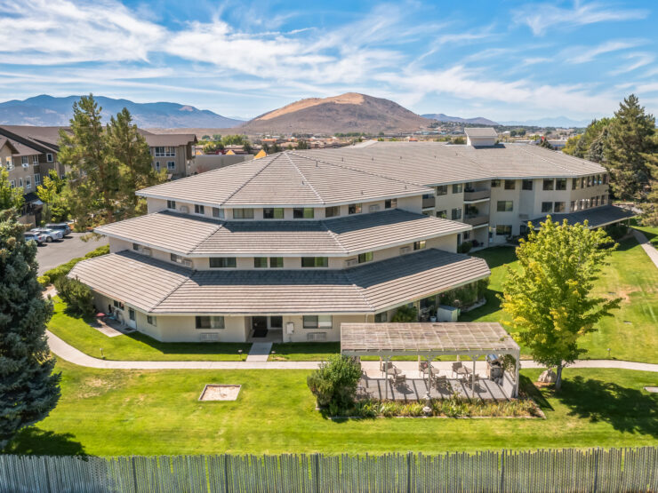 A welcoming retirement community surrounded by scenic views, fostering connection and tranquility.