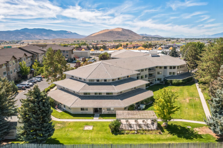 A welcoming retirement community nestled among scenic landscapes, promoting comfort and connection.