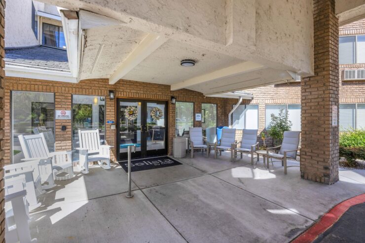 A welcoming entrance with seating invites community and connection in a serene environment.