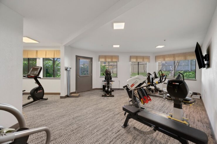 Bright and inviting fitness space, featuring modern equipment and natural light, fostering community wellness.
