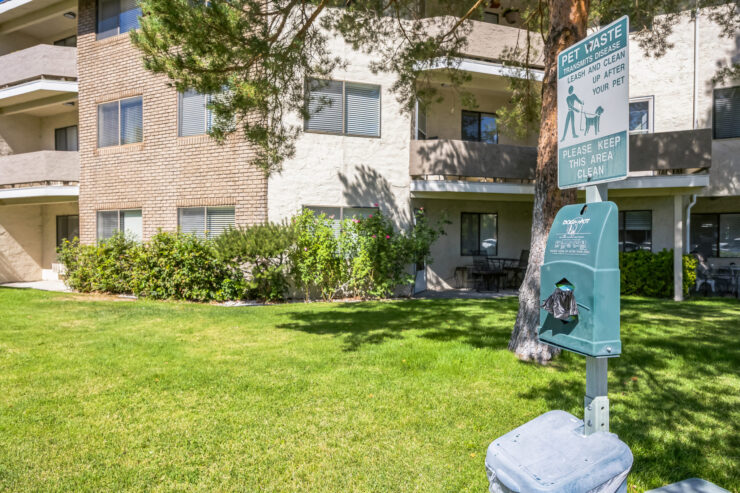 A welcoming outdoor space features well-maintained lawns and pet-friendly amenities, fostering community.