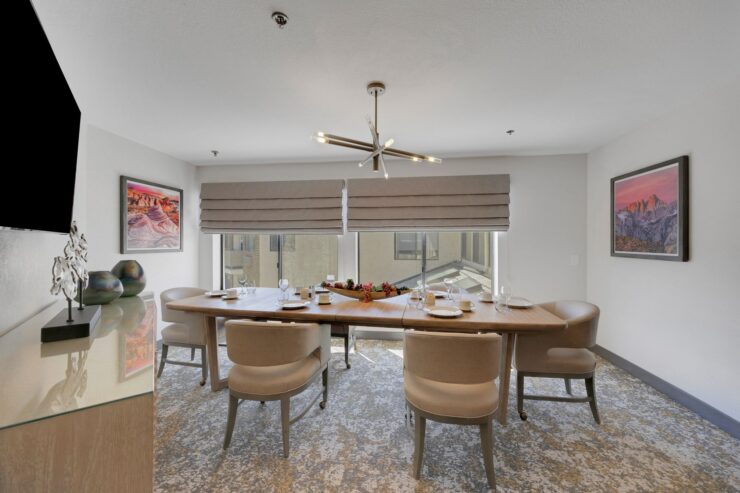 A welcoming dining area with natural light, inviting chairs, and a sense of community and warmth.