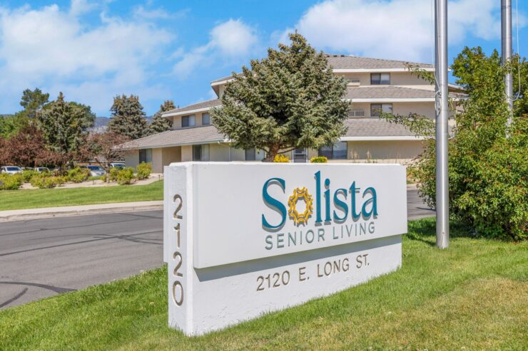 Welcoming sign of Solista Senior Living, showcasing a vibrant community and serene atmosphere.