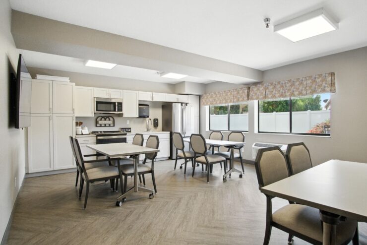 Bright and inviting dining area, fostering community and comfort for residents to enjoy meals together.